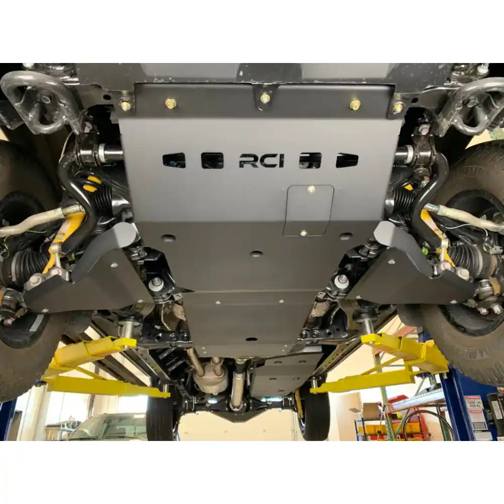 Underbody view showing RCI front skid plates installed