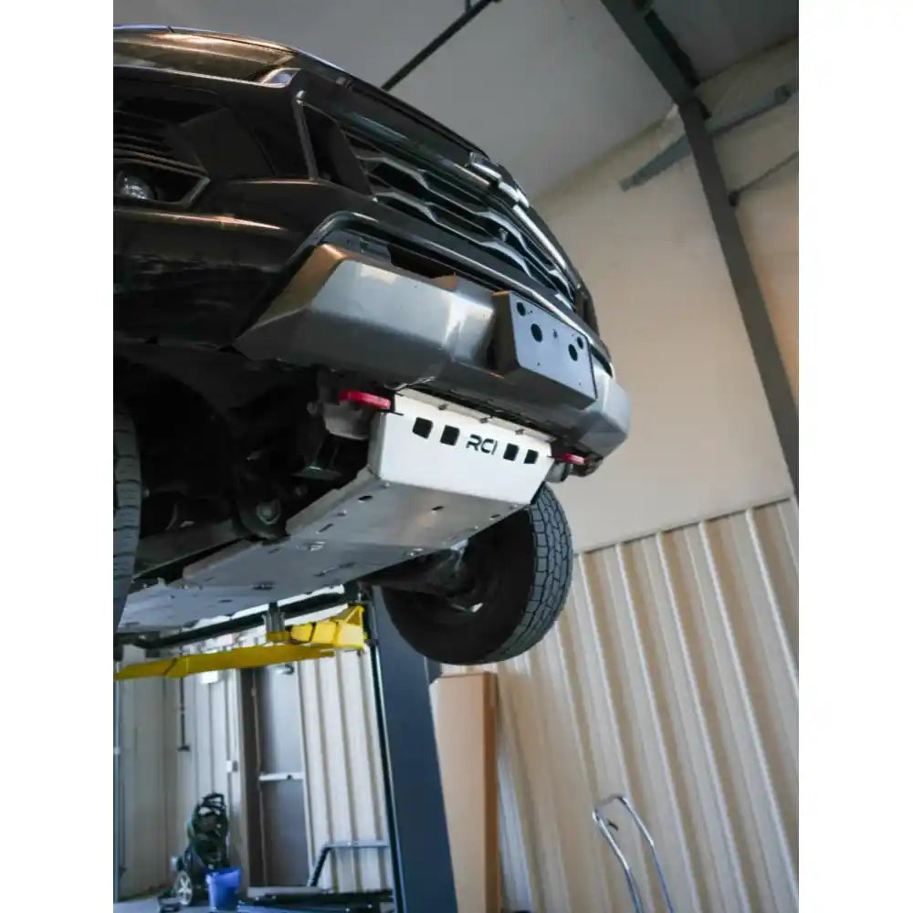 Underbody view showing RCI plate covering engine and transfer case