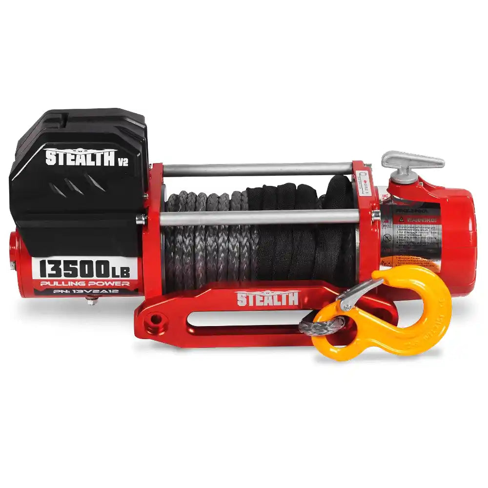 Red and black Stealth 13500lb electric winch with yellow hook on a white background