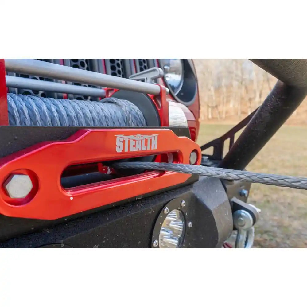 Close-up of a red winch with 'Stealth' branding on a vehicle.