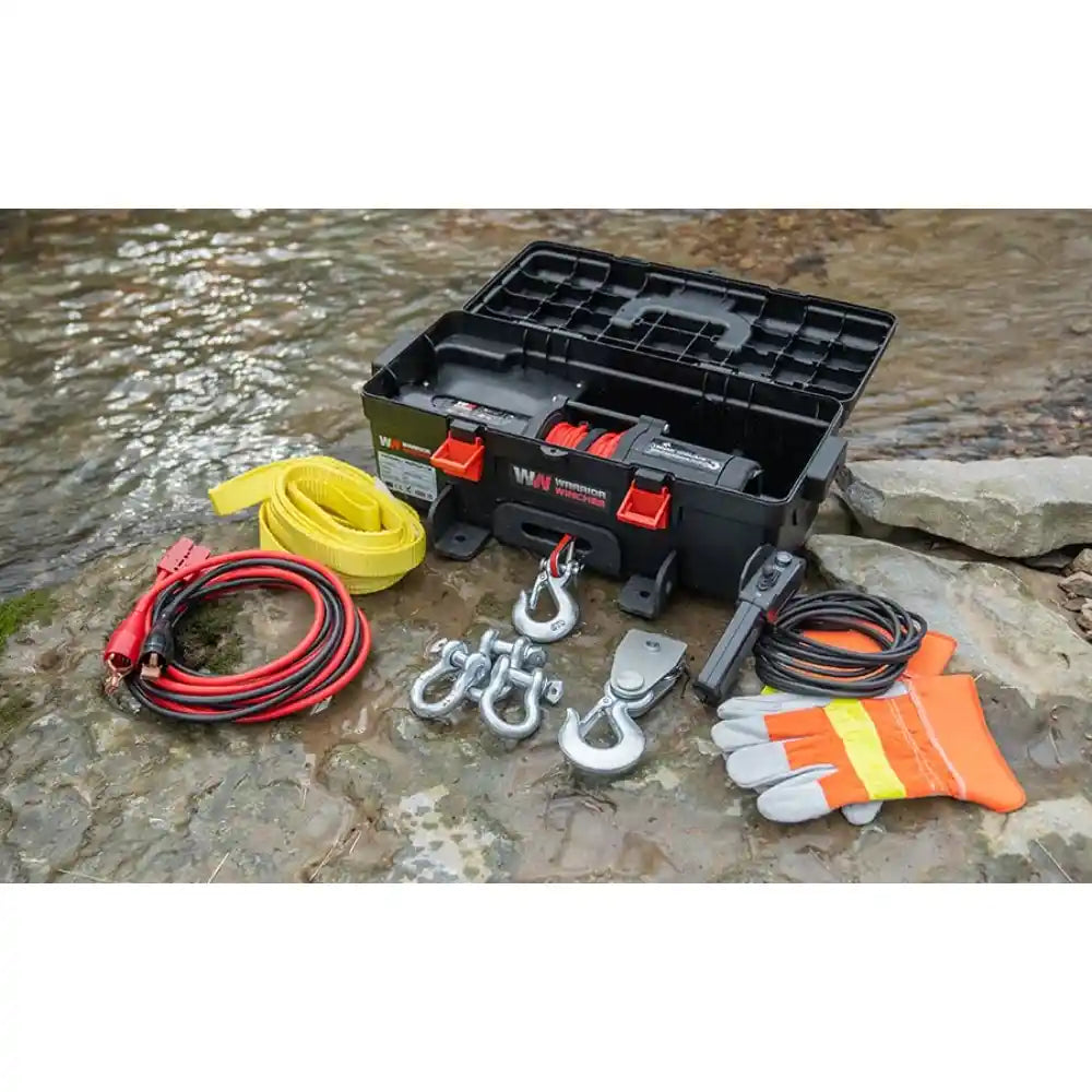 Utility winch with equipment on a rocky surface near water