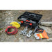 Utility winch with equipment on a rocky surface near water