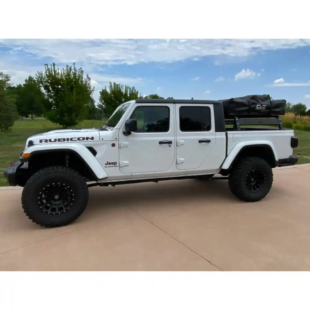 White Jeep with RCI rack and rooftop tent bag
