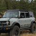 White off-road Bronco with RCI Off Road roof rack in a forested area
