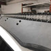 Close-up of the Cali Raised LED bracket installed in the Prinsu Roof Rack's extrusion channel