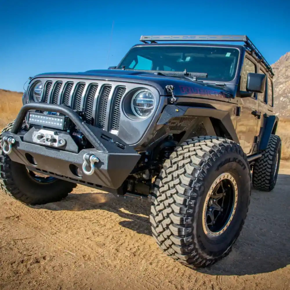 Front view of a black Jeep Wrangler JL 4-Door with the DV8 Offroad Roof Rack installed