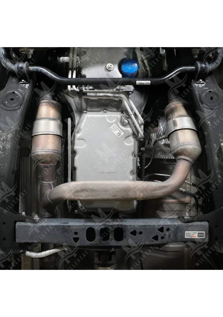 Close-up of a car's exhaust system and engine components.