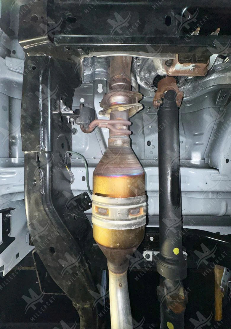 Close-up of a F450 suspension system with a focus on the axle and shock absorber without CAT Shield