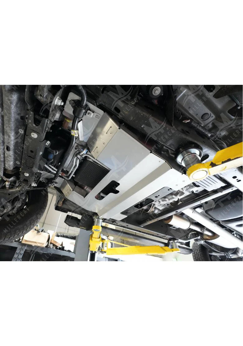 Angled view of installed MILLERCAT Cat Shield protecting catalytic converter