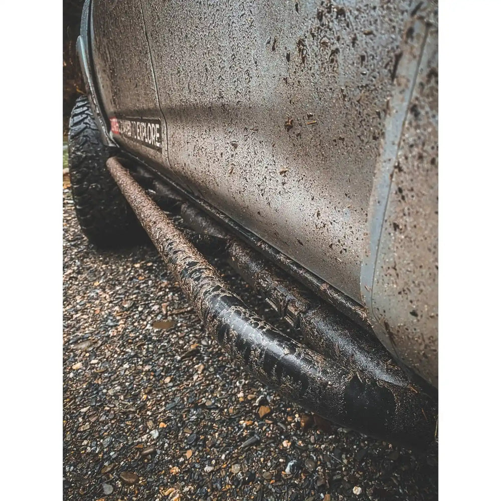 close up mounted view of the rock sliders on 4runner in dirt