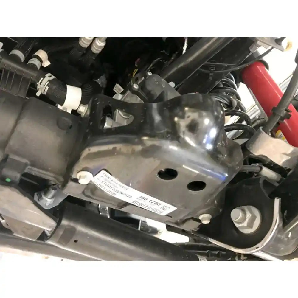 Close-up of mounted axle skid plate on JL