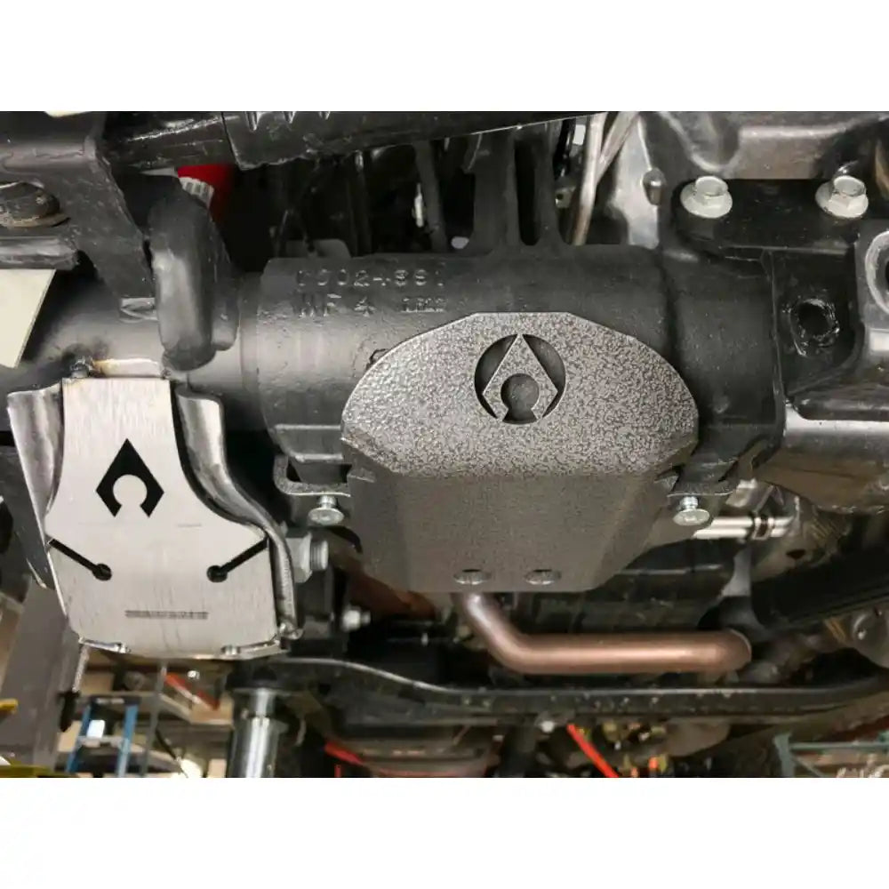 Close-up of a axle skid plate with a Artec logo.