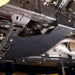Close-up of the no-drill bolt-on mounting hardware attaching the skid plate to the 4Runner's factory frame points