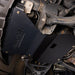 Angled underbody shot of the Juggernaut engine skid plate installed on a Ford Expedition