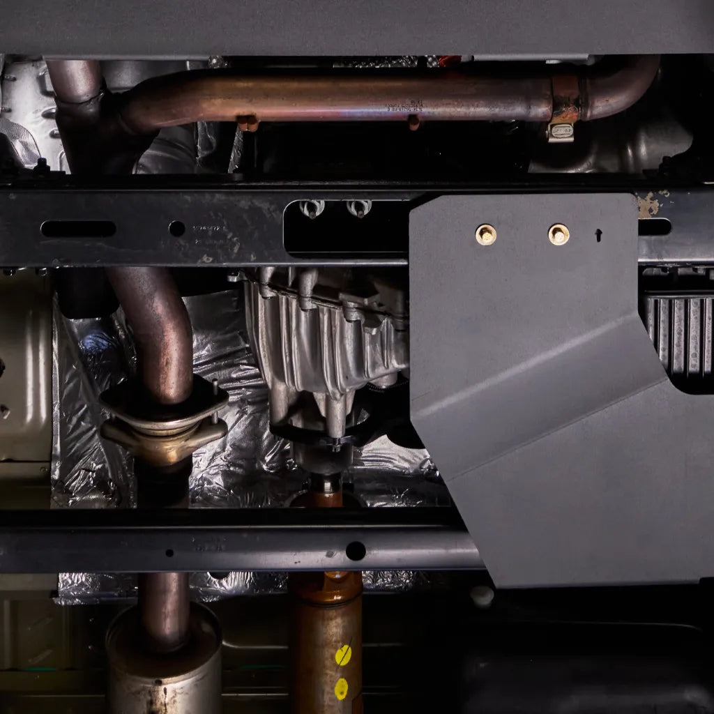 Juggernaut Ford Expedition skid plate package component with removable oil drain access panel visible