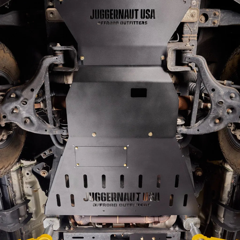 2018-2026 Ford Expedition on a lift with the Juggernaut full skid plate package installed underneath