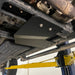 Juggernaut Ford Expedition transfer case skid plate shown up close, powder-coated black aluminum