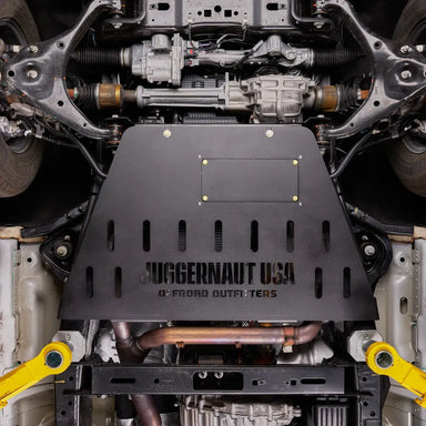 Juggernaut transmission skid plate and cat shield installed underneath a Ford Expedition