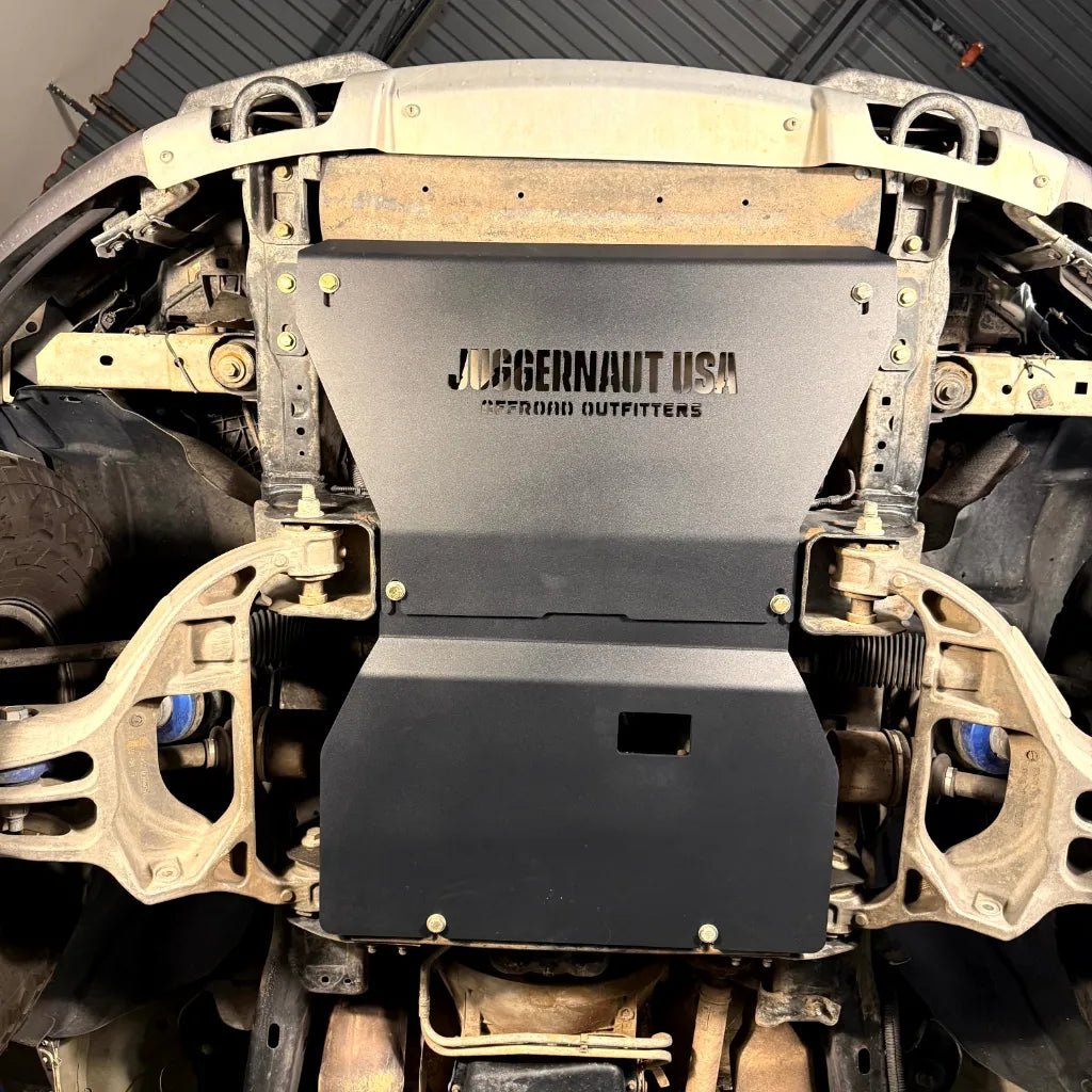 Juggernaut engine skid plate installed under the front of a 2009-2014 Ford F-150