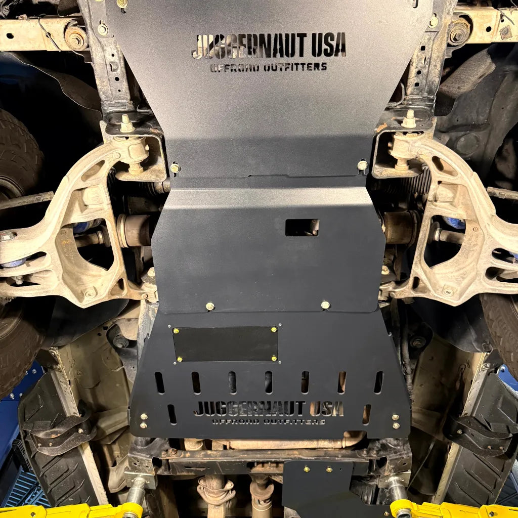 Juggernaut full skid plate package installed on a 2009-2014 Ford F-150 in raw aluminum finish
