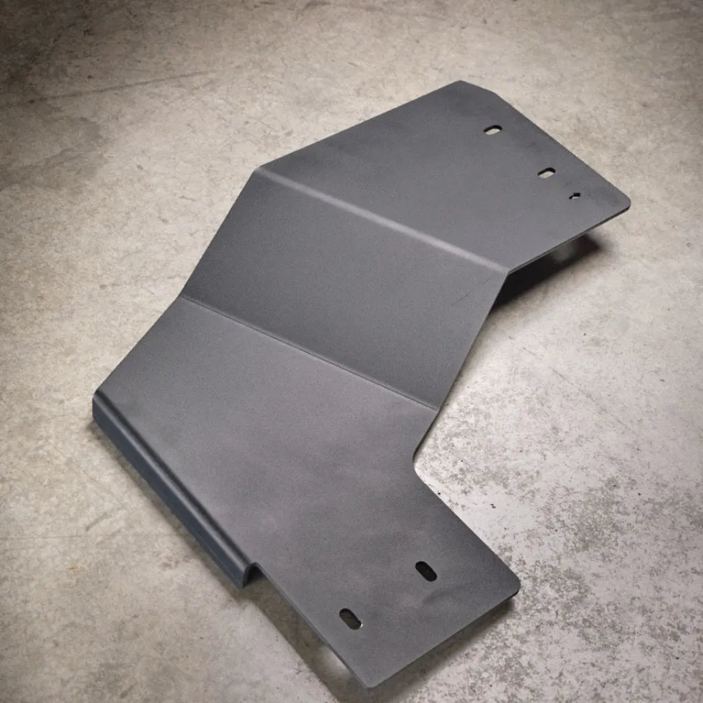 Juggernaut 2009-2014 Ford F-150 transfer case skid plate, product angle shot showing the aluminum plate and mounting brackets