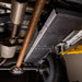 Juggernaut gas tank skid plate installed on a 2015-current Ford F-150, viewed from underneath the truck
