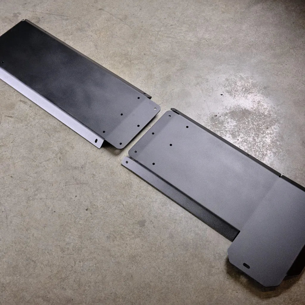 Juggernaut gas tank skid plate shown unassembled in two aluminum sections before installation