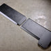 Juggernaut gas tank skid plate shown unassembled in two aluminum sections before installation