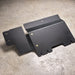 Juggernaut Ford F-150 Raptor transfer case skid plate, product angle shot showing the aluminum plate and mounting brackets
