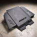 Juggernaut Ford F-150 Raptor transmission skid plate, product angle shot showing the 1/4 inch aluminum plate and crossmember mounting points