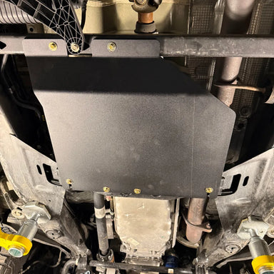 Juggernaut GMC Canyon transfer case skid plate, front product angle showing powder-coated black aluminum