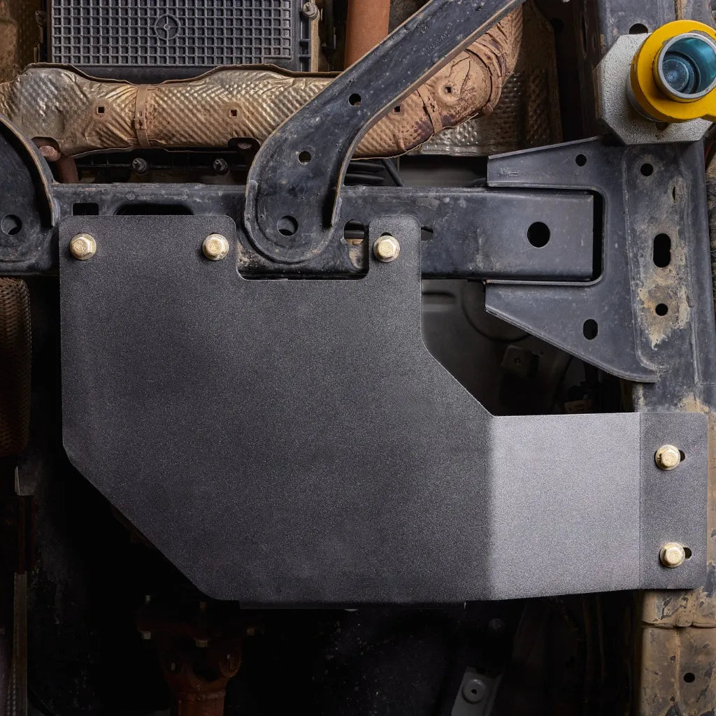 Juggernaut transfer case skid plate installed underneath a Ford Ranger behind the transmission