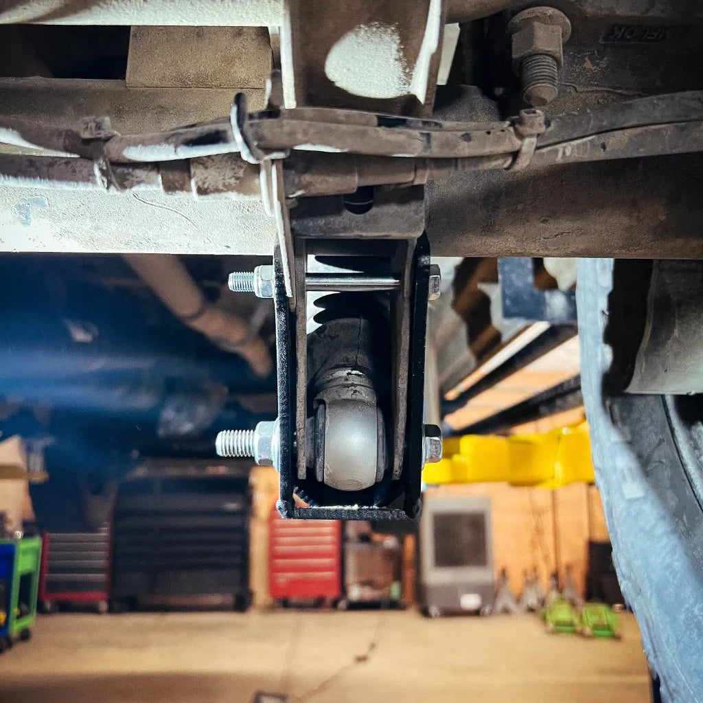 Juggernaut Mercedes Sprinter 4x4 rear shock skid plate mounting hardware close-up