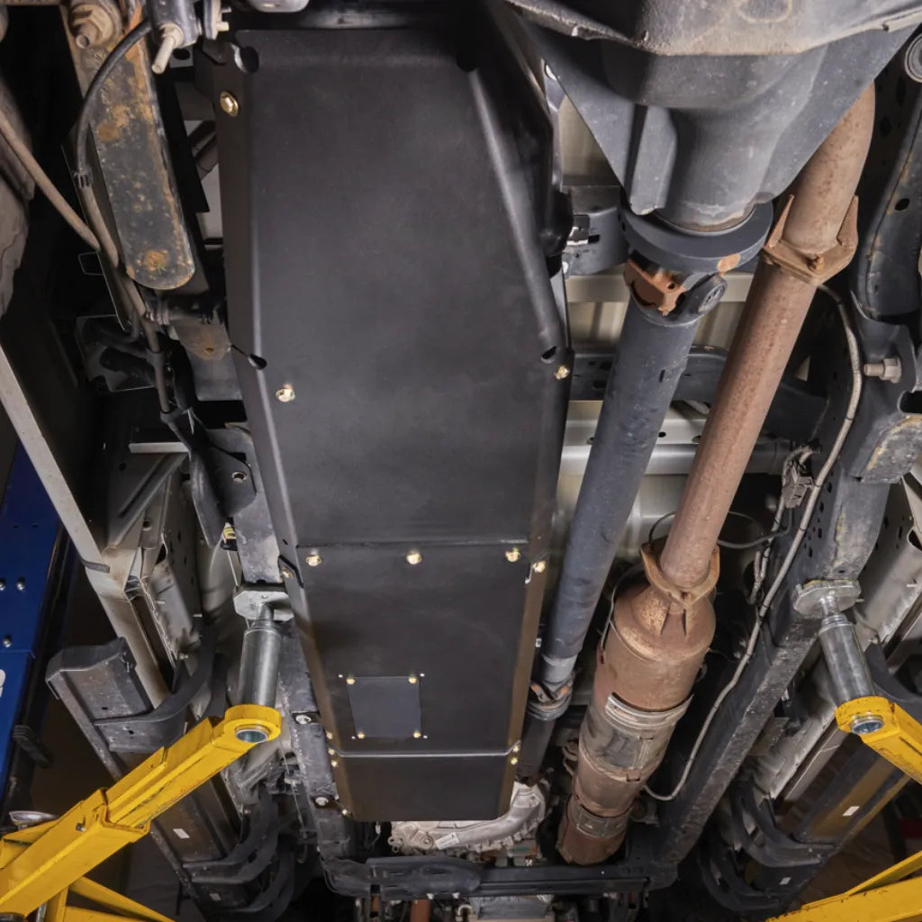 Close-up detail of Juggernaut Super Duty Fuel Tank Skid Plate edge and drain access