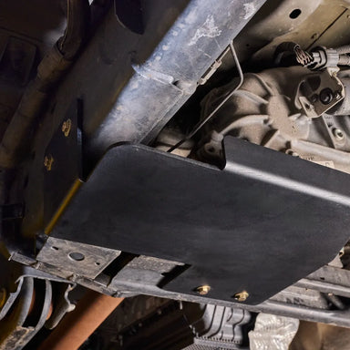 Juggernaut Super Duty Transfer Case Skid Plate installed underbody view, angle one