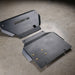 Juggernaut Tacoma engine skid plate, standalone product view on shop floor showing the embossed JUGGERNAUT USA logo