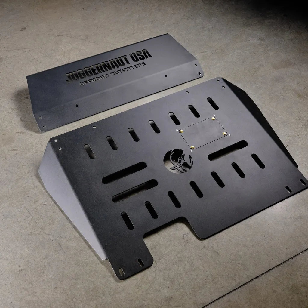 Ford Transit with the Juggernaut engine skid plate installed, parked on a trail