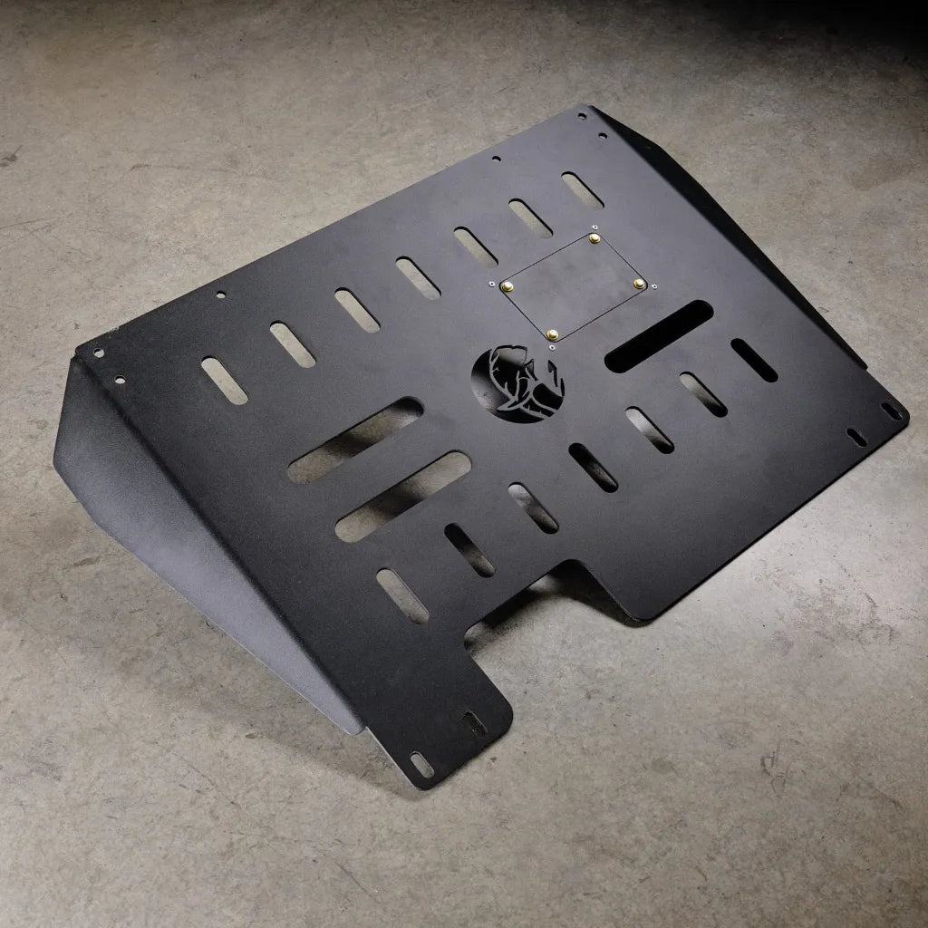 Underside view of a Ford Transit showing the Juggernaut engine skid plate installed