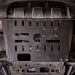 Ford Transit on a trail with the Juggernaut engine skid plate installed, front angle
