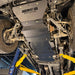 Full underbody view of the Juggernaut USA Silverado 2500HD/3500HD skid plate package installed front to back, showing engine, transmission, and transfer case coverage