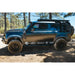 Leitner ACS ROOF rack on Defender 110 with side ladder, off-road side view