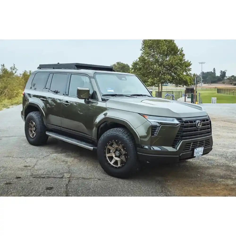 Green Lexus GX550 with Leitner ACS ROOF 3/4 rack, front three-quarter view