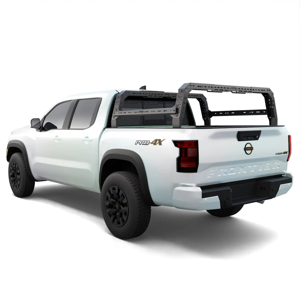 White Nissan Frontier truck with a bed rack on a white background