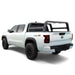 White Nissan Frontier truck with a bed rack on a white background