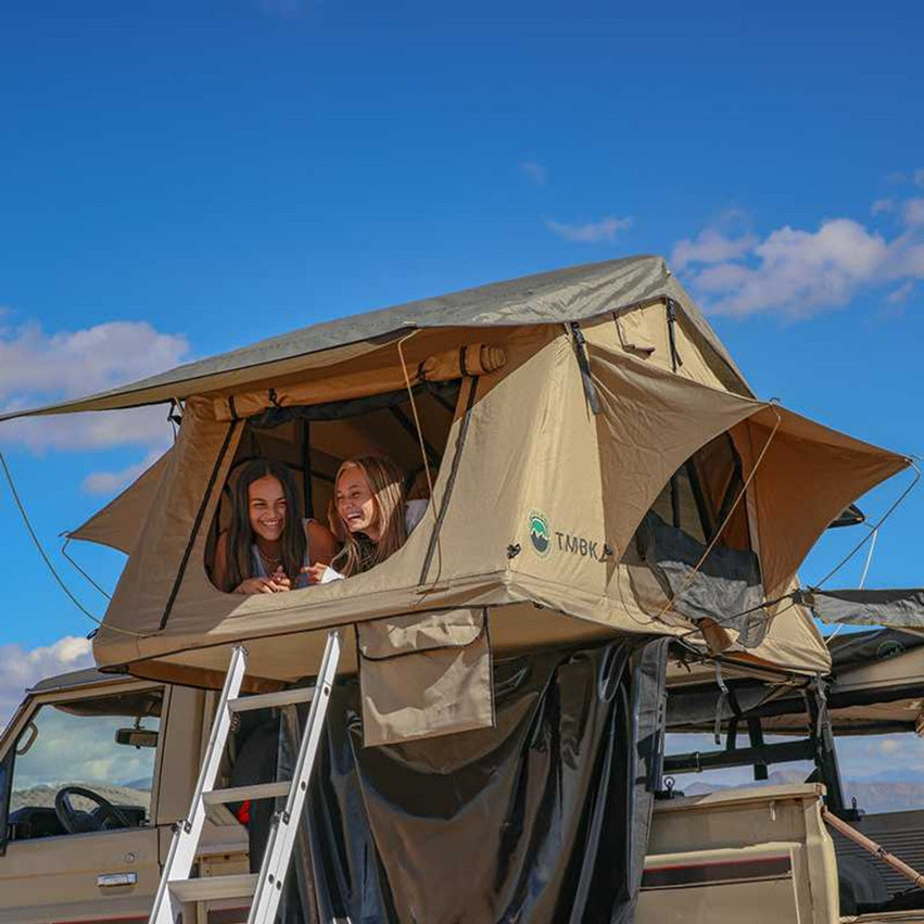 TMBK RTT mounted on truck with family inside the tent