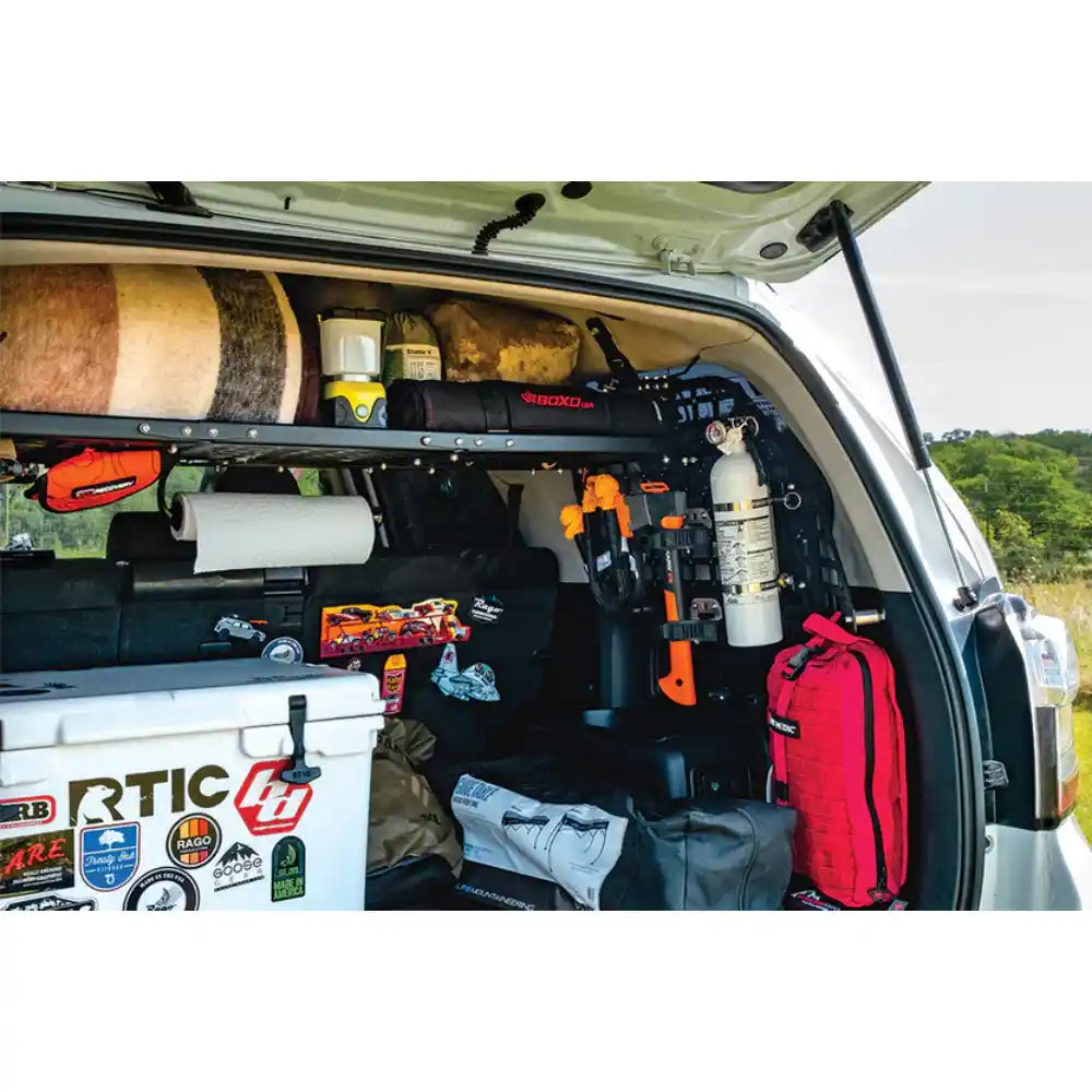 Rago 4Runner Molle storage shelf with gear, hatch open outdoors