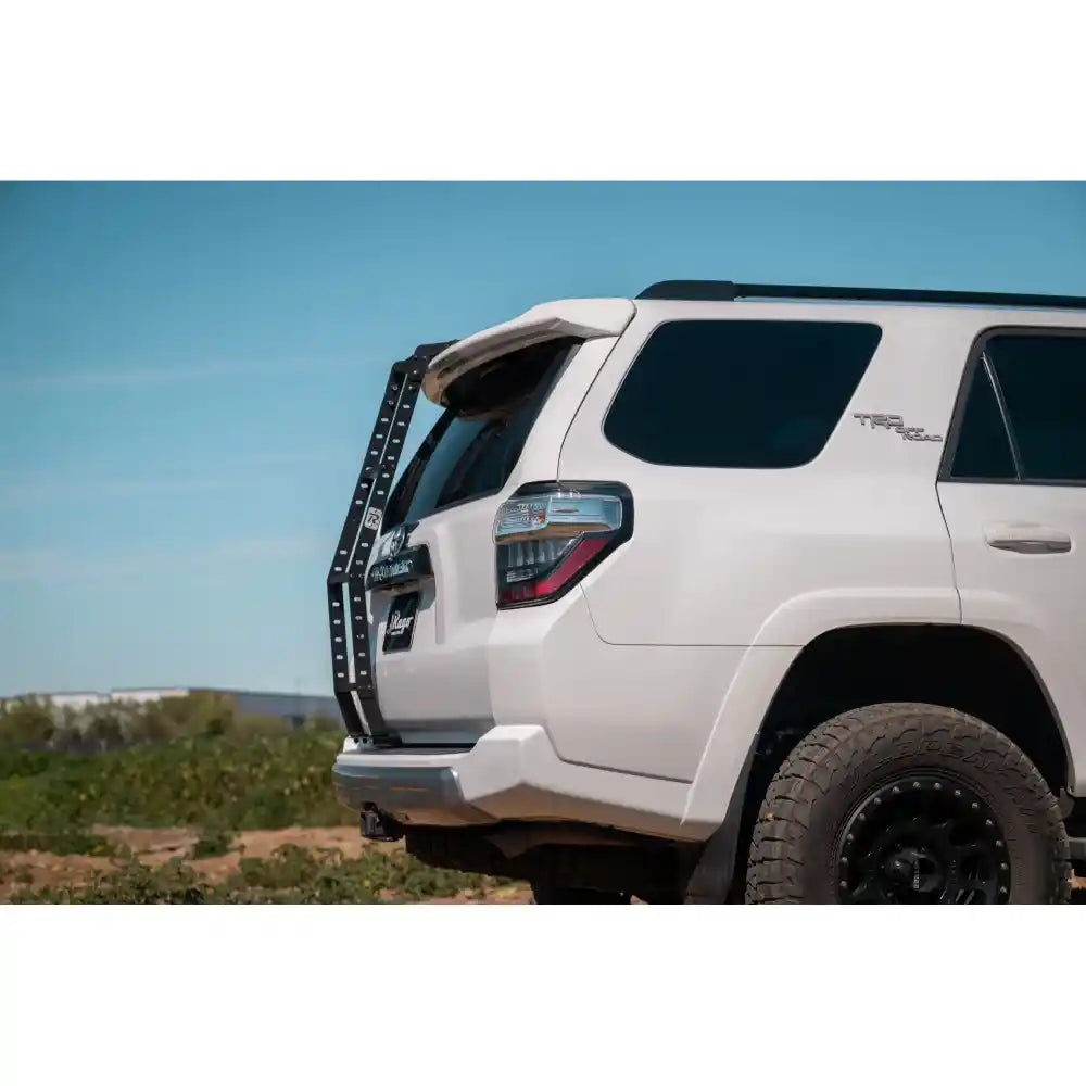 White 5th Gen 4Runner with Rago hatch ladder, rear three-quarter
