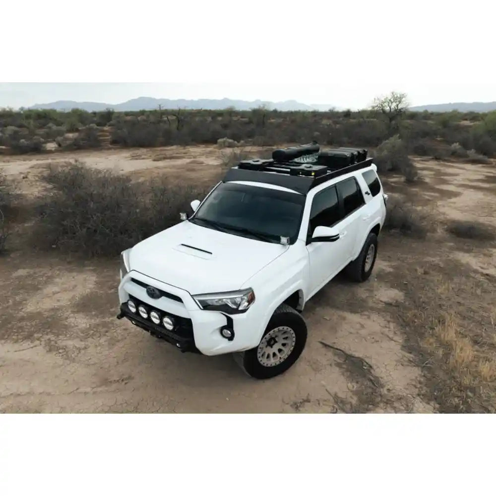 5th Gen 4Runner with Rago roof rack in desert, aerial front three-quarter