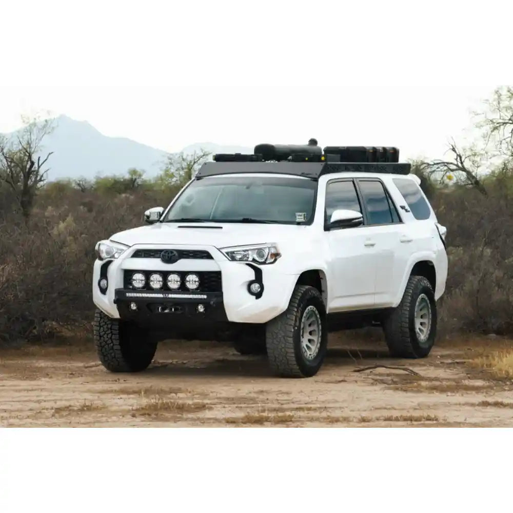 White 5th Gen Toyota 4Runner with Rago roof rack, lights and gear, front view