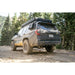 6th Gen 4Runner with Rago external Molle panels on trail, rear three-quarter